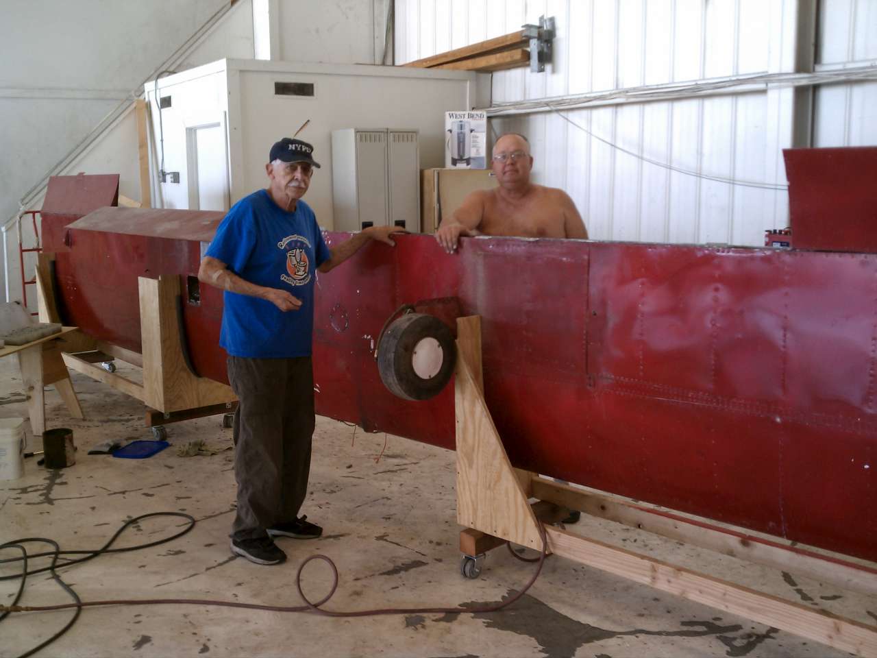 Dick and Chuck were installing the repaired right flap in El Monte