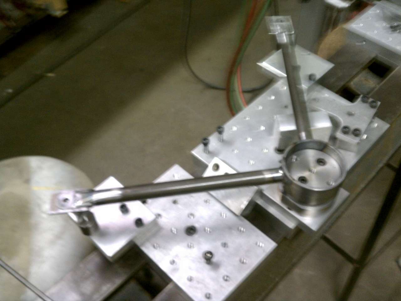 Nose gear brace in its welding fixture.